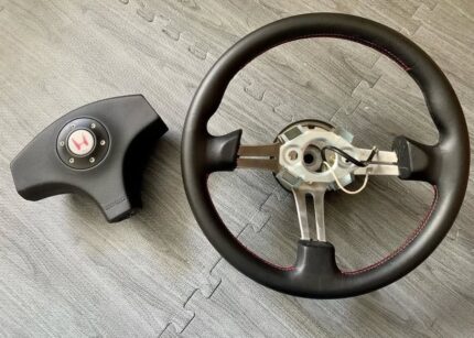 OEM 96’ ITR Momo Steering Wheel Original leather, red stitching.